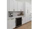 Modern kitchen with white cabinetry, stainless steel appliances, and wine fridge at 3220 W Frankfurt Dr, Chandler, AZ 85226