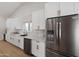 Bright kitchen with white cabinets and stainless appliances, featuring a kitchen island at 3220 W Frankfurt Dr, Chandler, AZ 85226