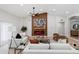 Bright living room showcasing a fireplace, plush seating, and contemporary design at 3220 W Frankfurt Dr, Chandler, AZ 85226