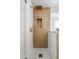 Modern shower features gold fixtures, white tile and wood accent wall at 3220 W Frankfurt Dr, Chandler, AZ 85226