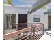 Exterior shot of unit E203 with secure gate, windows, and a well-maintained entryway at 3330 W Danbury Dr # E203, Phoenix, AZ 85053