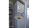 A clean, white, stackable washer and dryer unit is neatly fitted inside a laundry closet at 3330 W Danbury Dr # E203, Phoenix, AZ 85053