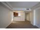 Spacious living room with plush carpet and natural light open to kitchen at 3330 W Danbury Dr # E203, Phoenix, AZ 85053