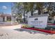 An attractive community sign for Phoenician Pines Condominium Homes, set amidst beautiful landscaping at 3330 W Danbury Dr # E203, Phoenix, AZ 85053