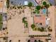 Aerial view of a desert property featuring a home, RV parking, and desert landscaping at 3614 W Phillips Rd, San Tan Valley, AZ 85144