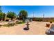 Paver patio and backyard feature a fountain, above-ground pool, lush landscaping, and inviting seating areas at 3614 W Phillips Rd, San Tan Valley, AZ 85144
