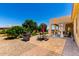 Outdoor dining area with a grill, a patio with seating, and desert landscaping at 3614 W Phillips Rd, San Tan Valley, AZ 85144