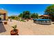 Spacious backyard featuring an above-ground pool, playground, fountain, mature trees, and outdoor seating areas at 3614 W Phillips Rd, San Tan Valley, AZ 85144