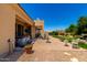 Expansive backyard features a patio, water fountain, hot tub, lounge chairs, and well-maintained landscaping at 3614 W Phillips Rd, San Tan Valley, AZ 85144