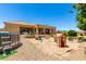 Large backyard with a playground, sandbox, above-ground pool, patio, and desert landscaping at 3614 W Phillips Rd, San Tan Valley, AZ 85144