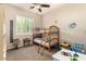 Bedroom featuring bunk beds, shuttered windows, and neutral colored walls at 3614 W Phillips Rd, San Tan Valley, AZ 85144