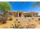 Stunning desert landscaping accents the home's front yard, offering curb appeal and low maintenance at 3614 W Phillips Rd, San Tan Valley, AZ 85144