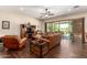 Spacious living room with hardwood floors, ceiling fan, and lots of natural light at 3614 W Phillips Rd, San Tan Valley, AZ 85144
