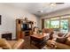 Inviting living room with comfortable seating and an entertainment center at 3614 W Phillips Rd, San Tan Valley, AZ 85144