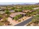 Aerial view of an estate featuring desert landscaping, a circular driveway, and a tile roof at 3946 N Pinnacle Hills Cir, Mesa, AZ 85207