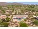 Aerial view of the home showcasing desert landscaping, a pool, and mountain views in a golf community at 3946 N Pinnacle Hills Cir, Mesa, AZ 85207