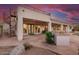 Stylish backyard with spiral staircase, covered patio, outdoor dining, built-in BBQ, and pristine pool at 3946 N Pinnacle Hills Cir, Mesa, AZ 85207