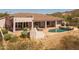 Backyard featuring a pool, covered patio, spa, and outdoor seating offering serene outdoor living at 3946 N Pinnacle Hills Cir, Mesa, AZ 85207