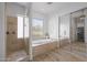 Tranquil bathroom with a walk-in shower, soaking tub, and a view of the outdoors, perfect for relaxation at 3946 N Pinnacle Hills Cir, Mesa, AZ 85207