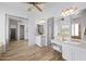 A well-lit bathroom with dual vanities, ample storage, and modern fixtures, creating a spa-like experience at 3946 N Pinnacle Hills Cir, Mesa, AZ 85207