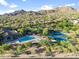 Resort-style community pool and tennis courts nestled in a picturesque desert landscape at 3946 N Pinnacle Hills Cir, Mesa, AZ 85207