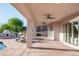 Spacious covered patio with outdoor kitchen, pool, and ample seating for entertaining at 3946 N Pinnacle Hills Cir, Mesa, AZ 85207