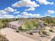 Beautiful desert home with a three-car garage and pristine landscaping and mountain views in the background at 3946 N Pinnacle Hills Cir, Mesa, AZ 85207