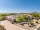The house has a spacious three-car garage, desert landscaping, and breathtaking views of surrounding mountains at 3946 N Pinnacle Hills Cir, Mesa, AZ 85207