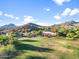 Beautiful golf course with mountain views and lush green grass in a well-maintained community at 3946 N Pinnacle Hills Cir, Mesa, AZ 85207