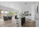 Bright kitchen with white cabinetry, granite countertops, stainless steel appliances, and a cozy breakfast nook at 3946 N Pinnacle Hills Cir, Mesa, AZ 85207