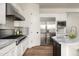 Bright kitchen with stainless steel appliances, marble countertops, and a gas cooktop range at 3946 N Pinnacle Hills Cir, Mesa, AZ 85207