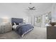 Serene main bedroom with a plush bed, tray ceiling, and natural light, creating a relaxing retreat at 3946 N Pinnacle Hills Cir, Mesa, AZ 85207