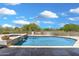 Enjoy desert days in this sparkling pool with spa and stone waterfall feature, surrounded by lush native landscaping at 3946 N Pinnacle Hills Cir, Mesa, AZ 85207