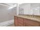 Bathroom featuring dual sinks, vanity and glass shower at 3977 E Cat Balue Dr, Phoenix, AZ 85050
