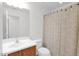 Bright bathroom features a sink, a toilet and a tub with curtain at 3977 E Cat Balue Dr, Phoenix, AZ 85050