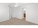Bedroom with carpet, ceiling fan, and view of en suite bathroom at 3977 E Cat Balue Dr, Phoenix, AZ 85050