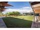 Exterior view of the community clubhouse, green space and patio furniture at 3977 E Cat Balue Dr, Phoenix, AZ 85050