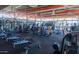 A bright and airy gym is equipped with state-of-the-art equipment, offering a comprehensive fitness experience for residents at 3977 E Cat Balue Dr, Phoenix, AZ 85050