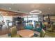 Open lounge area with comfortable seating, a stone fireplace, and an inviting atmosphere at 3977 E Cat Balue Dr, Phoenix, AZ 85050