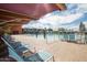 Community pool with lots of lounge seating and water features offers the perfect place to relax under the desert sun at 3977 E Cat Balue Dr, Phoenix, AZ 85050