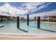 Modern pool features water fountains for an elegant and relaxing atmosphere surrounded by lounging areas and beautiful landscaping at 3977 E Cat Balue Dr, Phoenix, AZ 85050