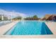 Clear blue swimming pool featuring lounge chairs, landscaping, and sunny views for a serene escape at 3977 E Cat Balue Dr, Phoenix, AZ 85050