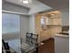 Kitchen and adjacent dining area with modern table and chairs at 4554 E Paradise Village Pkwy # 149, Phoenix, AZ 85032