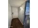 Inviting entryway featuring wood flooring and a view of the kitchen at 4554 E Paradise Village Pkwy # 149, Phoenix, AZ 85032