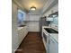 Bright kitchen featuring white cabinets, stainless steel appliances, and modern countertops at 4554 E Paradise Village Pkwy # 149, Phoenix, AZ 85032