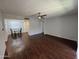 Open-concept living room with hard wood flooring, with kitchen and dining area at 4554 E Paradise Village Pkwy # 149, Phoenix, AZ 85032