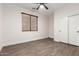 A spacious bedroom with ceiling fan, window and closet at 46065 W Meadows Ln, Maricopa, AZ 85139