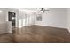Spacious bedroom with wood floors, dual closets, and ceiling fan at 46065 W Meadows Ln, Maricopa, AZ 85139