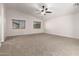 Bedroom with neutral carpet, vaulted ceiling and a ceiling fan at 46065 W Meadows Ln, Maricopa, AZ 85139