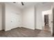 A bedroom with fan and closet and view to the bathroom at 46065 W Meadows Ln, Maricopa, AZ 85139